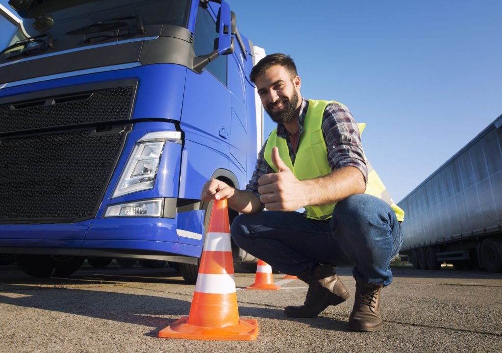 Man learning how to drive truck at driving schools.